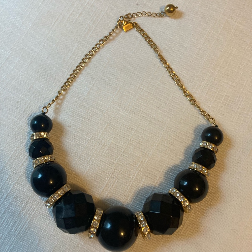NWOT black and gold Kate Spade statement necklace with original bag. Sparkly!